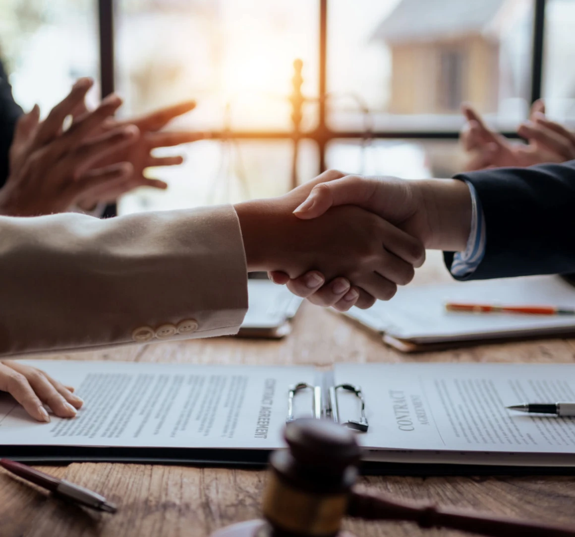 Business handshake over a contract